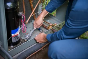 technician working on an air conditioner