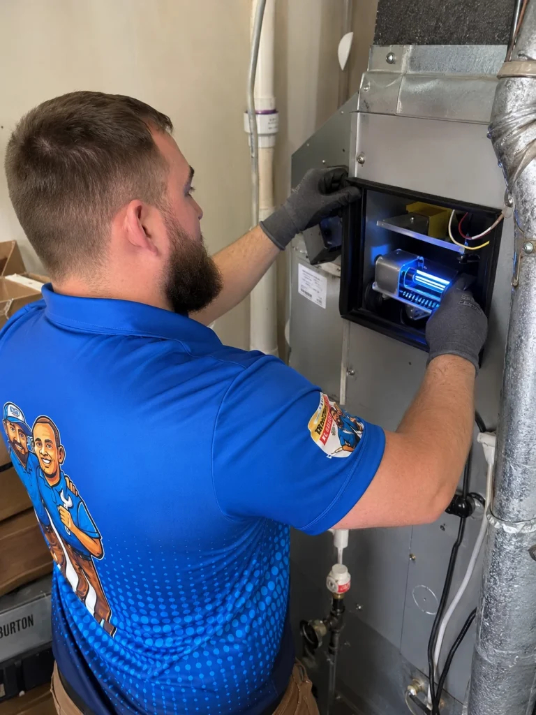 Strickland technician installing an hvac uv purification unit
