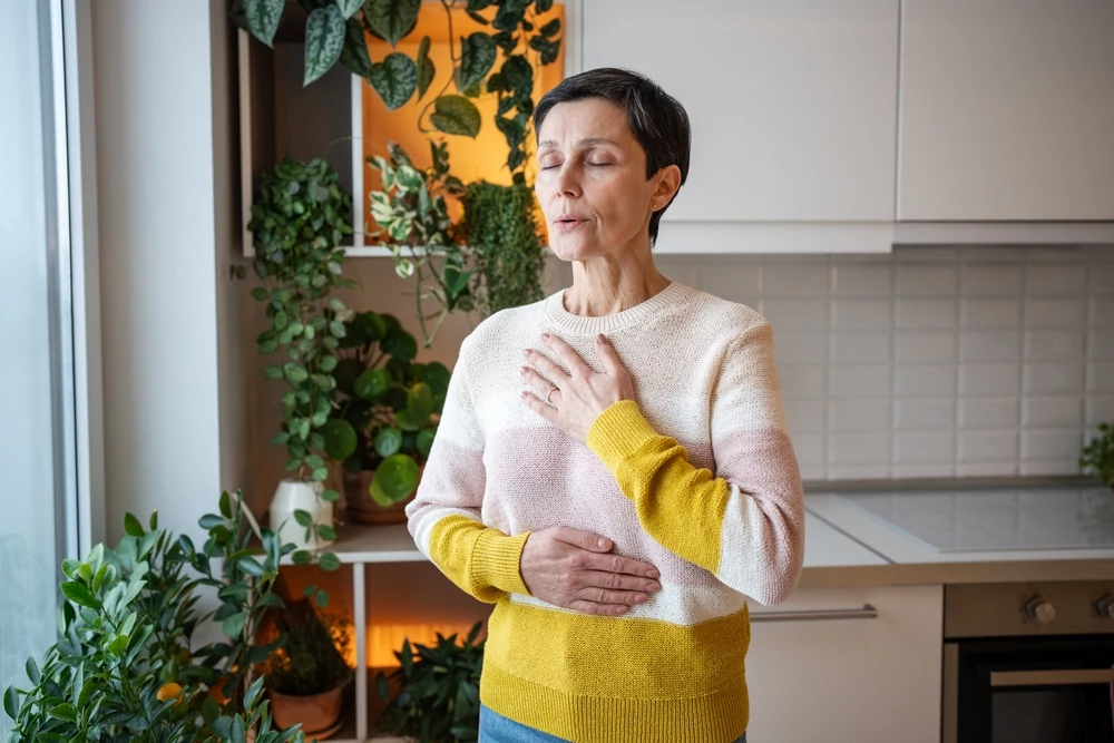 Woman taking a deep breath